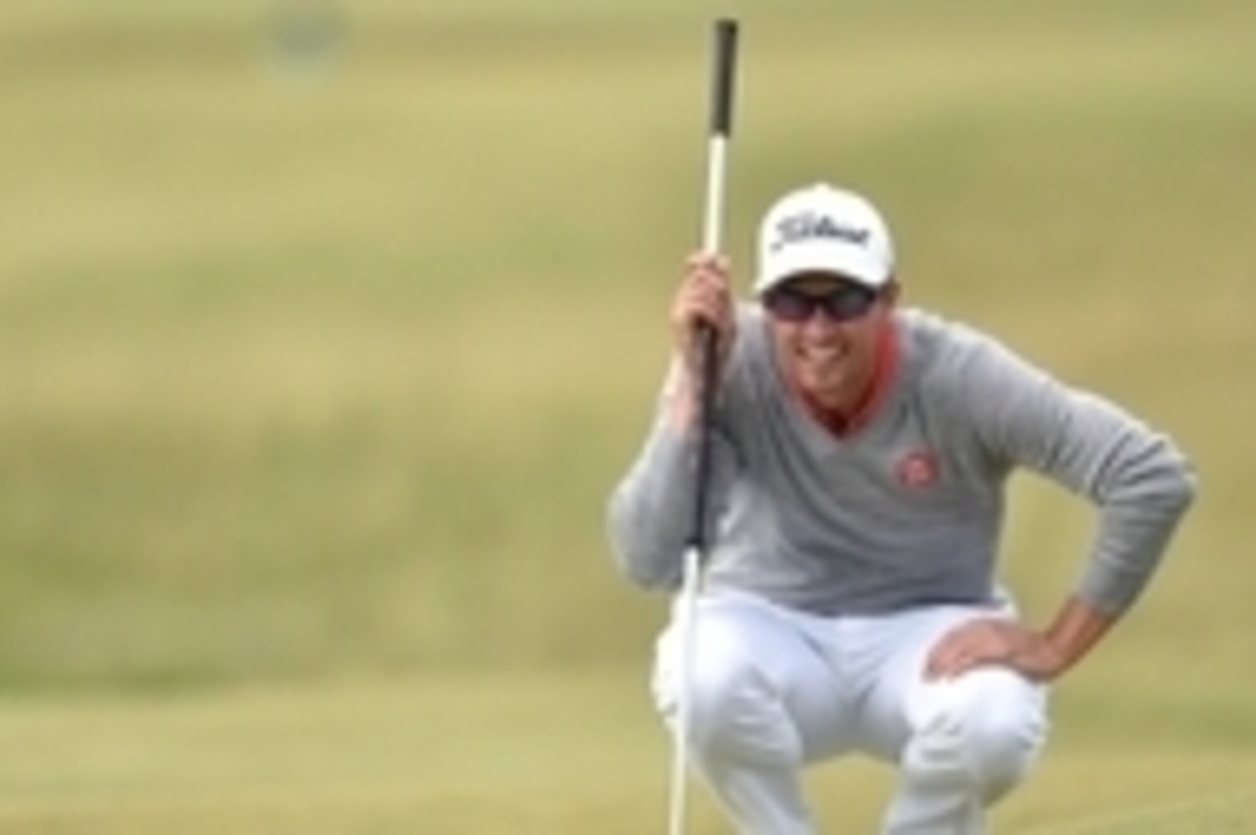 Jul 17, 2015; St Andrews, SCT; Adam Scott lines up a birdie putt on the 12th hole during the second round of the 144th Open Championship at St Andrews - Old Course. Mandatory Credit: Steve Flynn-USA TODAY Sports