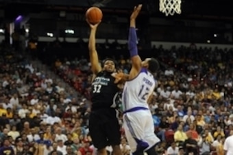 Jul 10, 2015; Las Vegas, NV, USA; Minnesota Timberwolves forward Karl-Anthony Towns (32) shoots against the defense of Los Angeles Lakers center Robert Upshaw (12) during an NBA Summer League game at Thomas & Mack Center. Minnesota won the game 81-68. Man