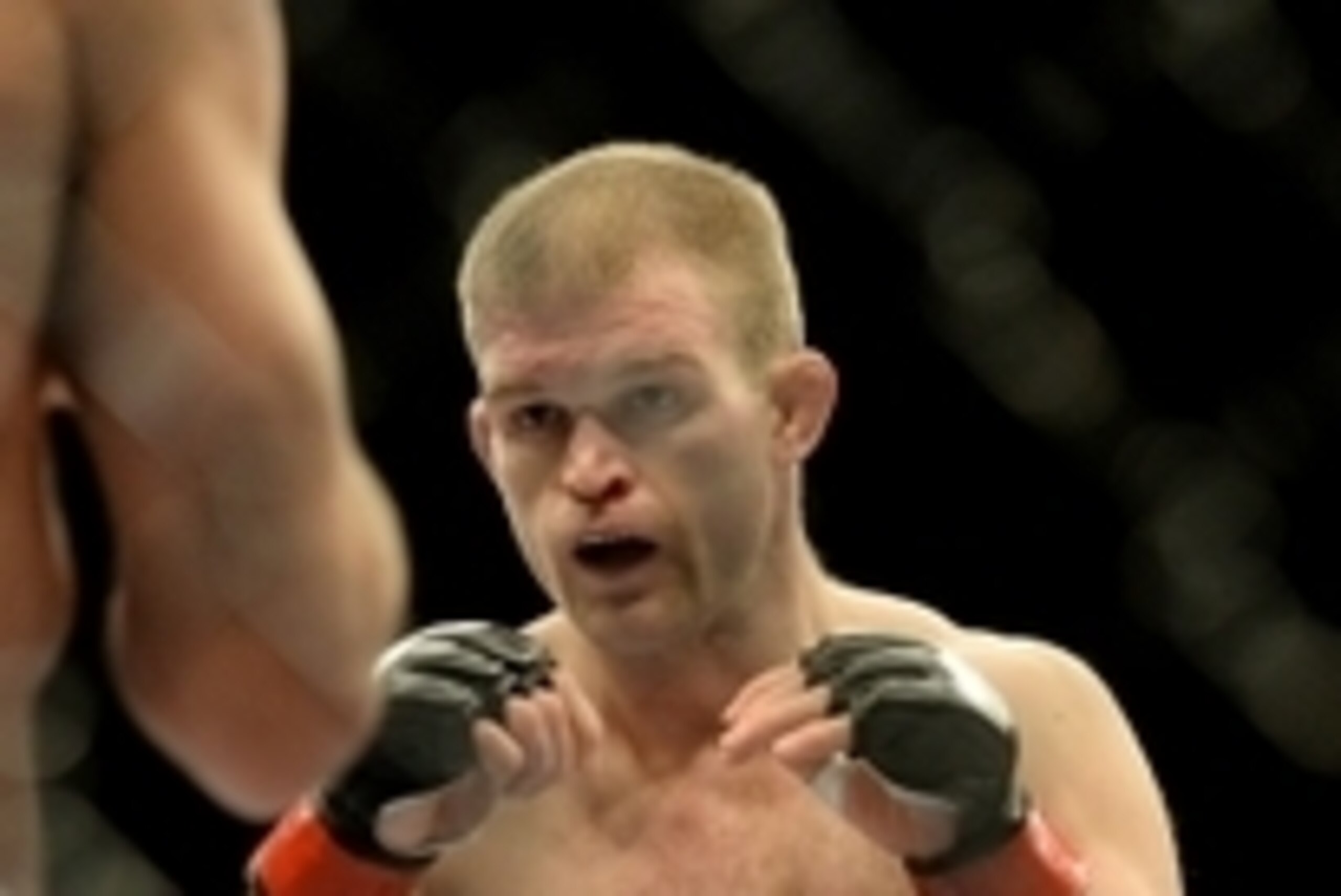 Jan 3, 2015; Las Vegas, NV, USA; Evan Dunham (red gloves) during his lightweight bout against Rodrigo Damm (not pictured) at UFC 182 at MGM Grand Garden Arena. Dunham won. Mandatory Credit: Jayne Kamin-Oncea-USA TODAY Sports