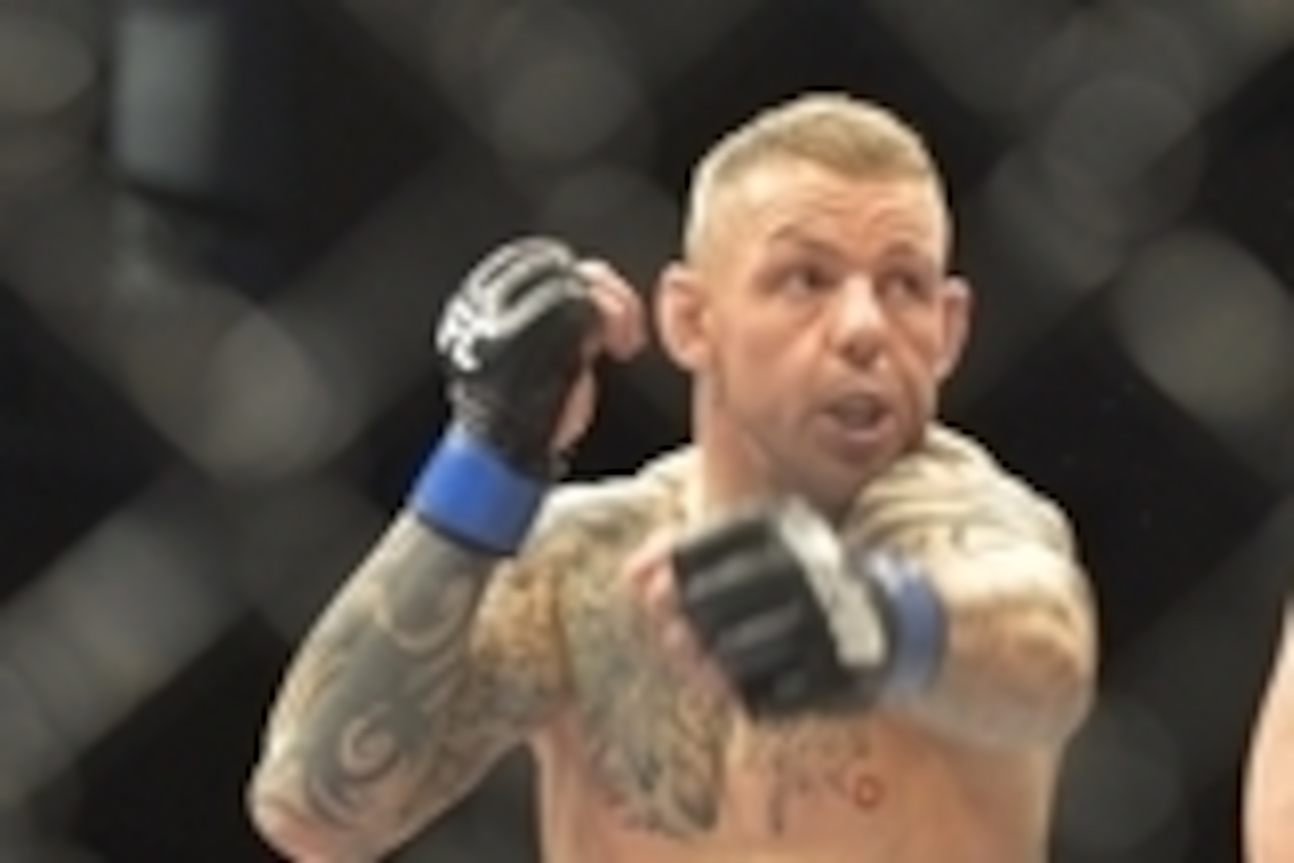 Aug 16, 2014; Bangor, ME, USA; Gray Maynard (red gloves) fights Ross Pearson (blue gloves) during lightweight bout at Cross Insurance Center. Mandatory Credit: Gregory J. Fisher-USA TODAY Sports