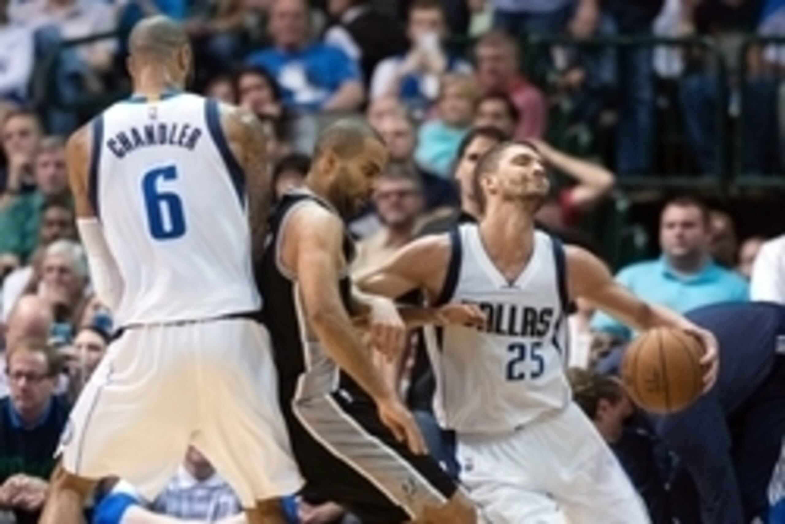 Mar 24, 2015; Dallas, TX, USA; Dallas Mavericks center Tyson Chandler (6) and forward Chandler Parsons (25) and San Antonio Spurs guard Tony Parker (9) during the game at the American Airlines Center. The Mavericks defeated the Spurs 101-94. Mandatory Cre