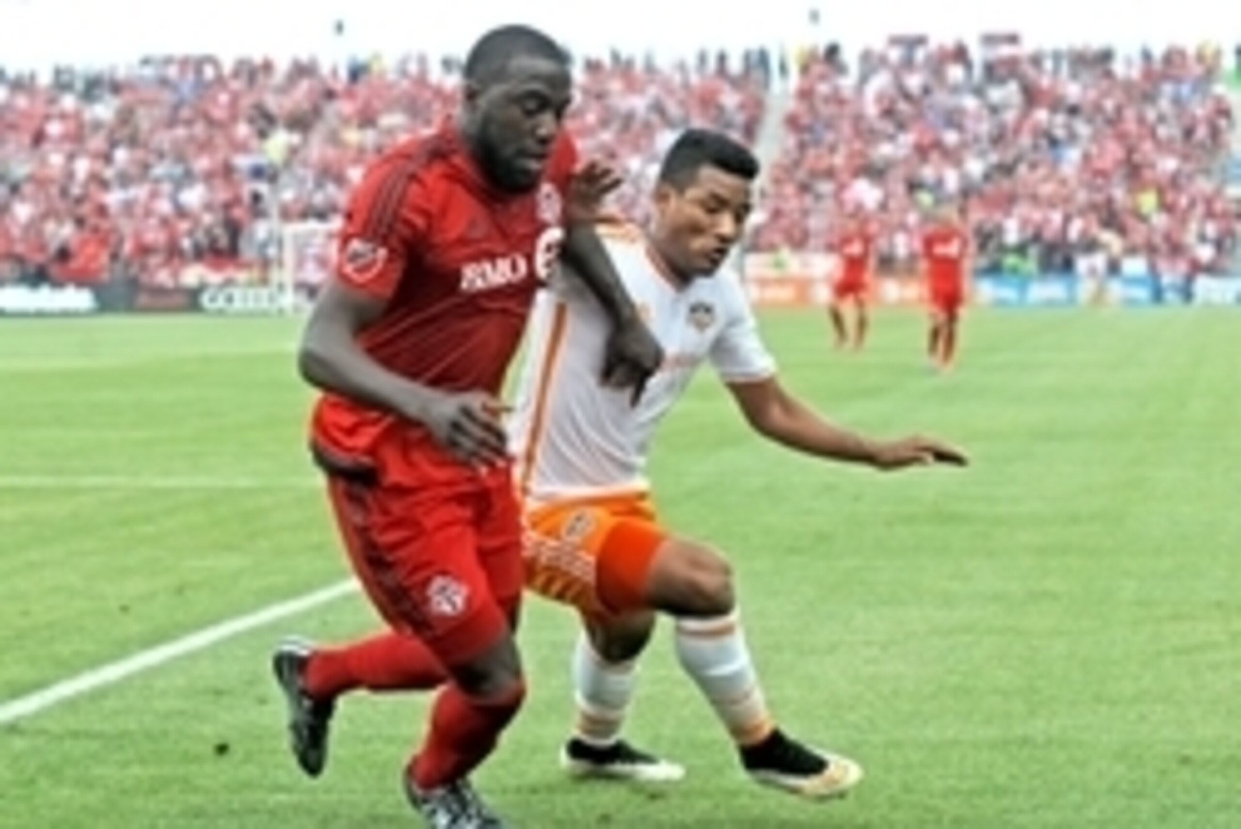 May 10, 2015; Toronto, Ontario, CAN; Toronto FC forward Jozy Altidore (10) battles for the ball with Houston Dynamo midfielder Luis Garrido (8) in the first half at BMO Field. Mandatory Credit: Dan Hamilton-USA TODAY Sports May 10, 2015; Toronto, Ontario, CAN; Toronto FC forward Jozy Altidore (10) battles for the ball with Houston Dynamo midfielder Luis Garrido (8) in the first half at BMO Field. Mandatory Credit: Dan Hamilton-USA TODAY Sports