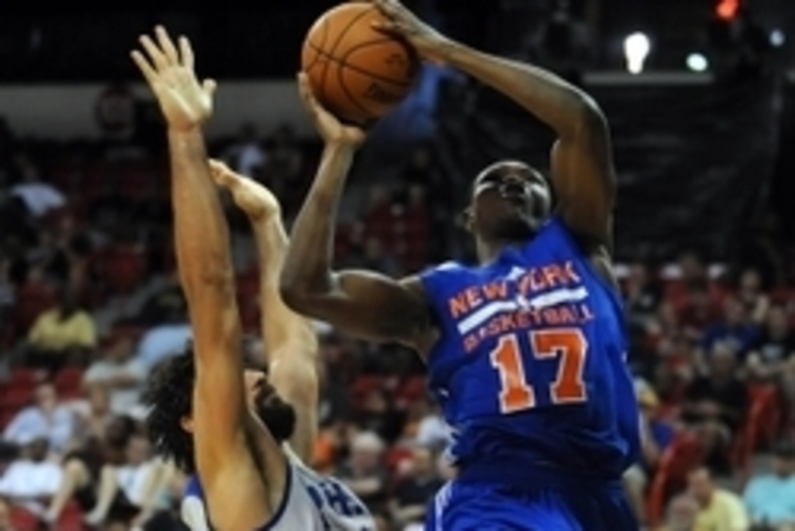 Jul 14, 2015; Las Vegas, NV, USA; New York Knicks forward Cleanthony Early (17) shoots against the defense of Philadelphia 76ers forward Arsalan Kazemi (14) during an NBA Summer League game at Thomas & Mack Center. The Knicks won the game in overtime, 84-