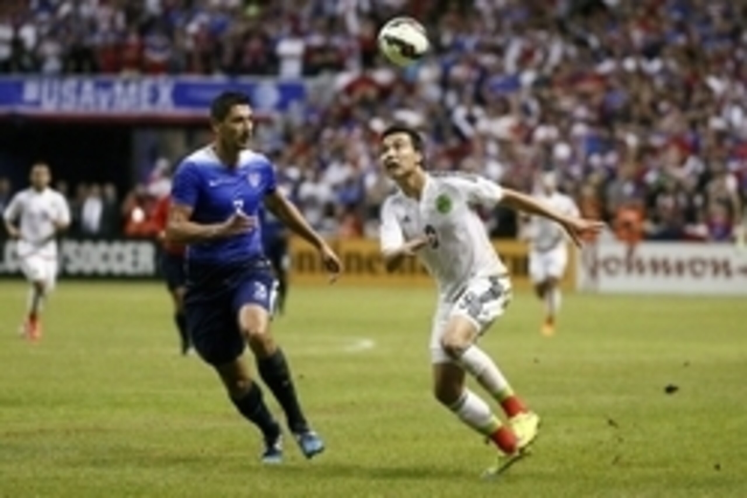 Apr 15, 2015; San Antonio, TX, USA; USA defender Omar Gonzalez (3) and Mexico forward Erick Torres (9) go for the ball during the first half at Alamodome. Mandatory Credit: Soobum Im-USA TODAY Sports