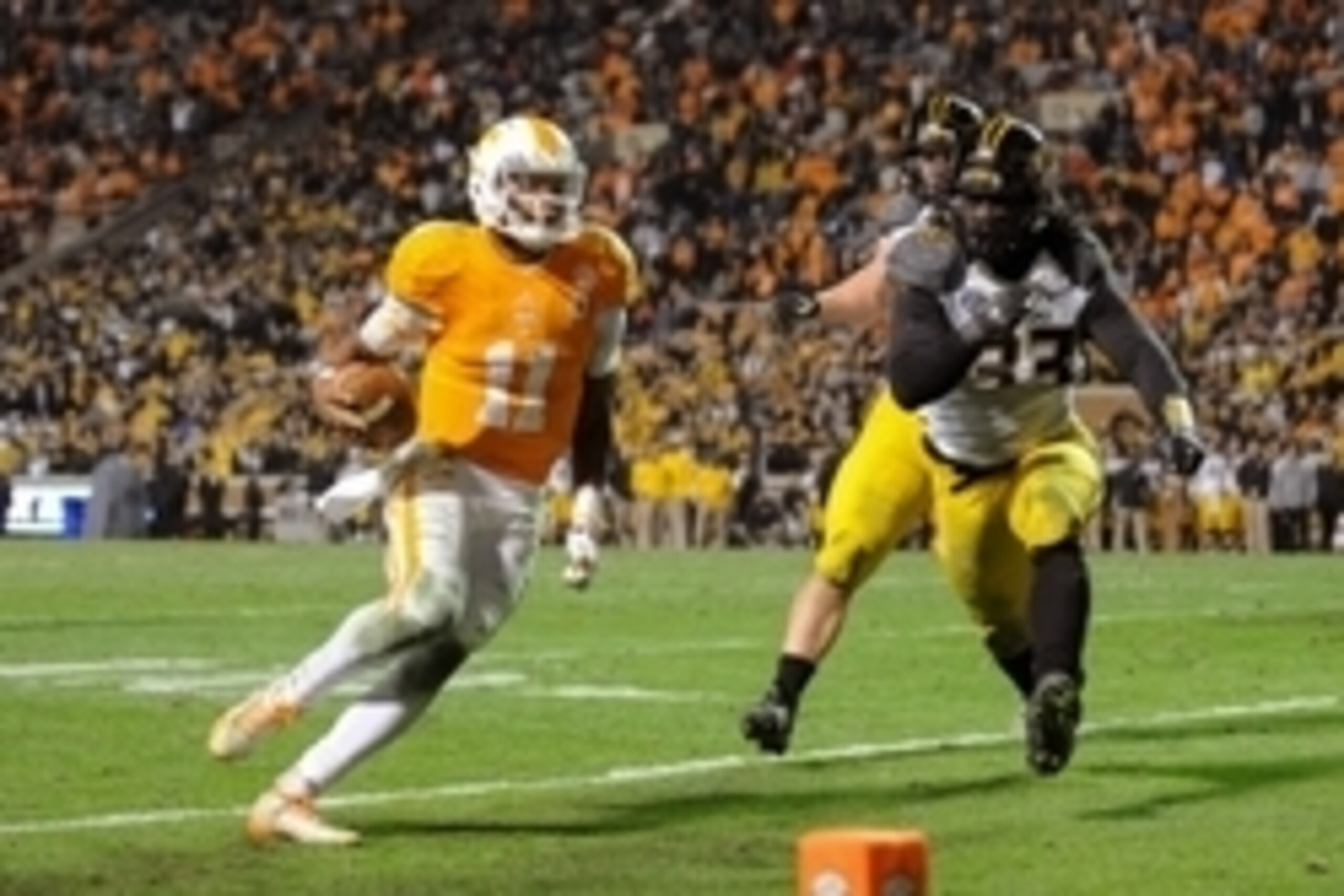 Nov 22, 2014; Knoxville, TN, USA; Tennessee Volunteers quarterback Joshua Dobbs (11) runs for a two point conversion against the Missouri Tigers during the first quarter at Neyland Stadium. Missouri won 29 to 21. Mandatory Credit: Randy Sartin-USA TODAY Nov 22, 2014; Knoxville, TN, USA; Tennessee Volunteers quarterback Joshua Dobbs (11) runs for a two point conversion against the Missouri Tigers during the first quarter at Neyland Stadium. Missouri won 29 to 21. Mandatory Credit: Randy Sartin-USA TODAY