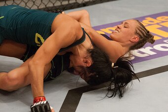 LAS VEGAS, NV - AUGUST 14:  Team Melendez fighter Rose Namajunas (bottom) attempts to submit team Pettis fighter Randa Markos during filming of season twenty of The Ultimate Fighter on August 14, 2014 in Las Vegas, Nevada. (Photo by Brandon Magnus/Zuffa L