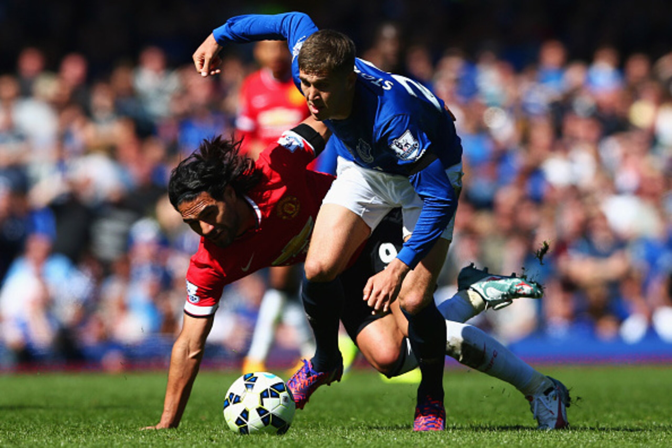 LIVERPOOL, ENGLAND - APRIL 26:  John Stones of Everton battles with Radamel Falcao Garcia of Manchester United during the Barclays Premier League match between Everton and Manchester United at Goodison Park on April 26, 2015 in Liverpool, England.  (Photo