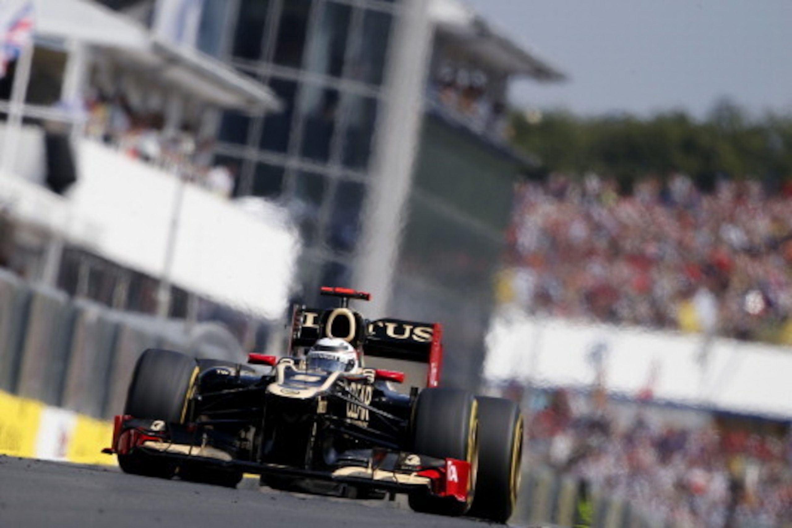 Lotus F1 Team's Finnish driver Kimi Raikkonen drives at the Hungaroring circuit on July 29, 2012 in Budapest during the Formula One Hungarian Grand Prix.      AFP PHOTO / PETER KOHALMI        (Photo credit should read PETER KOHALMI/AFP/GettyImages)