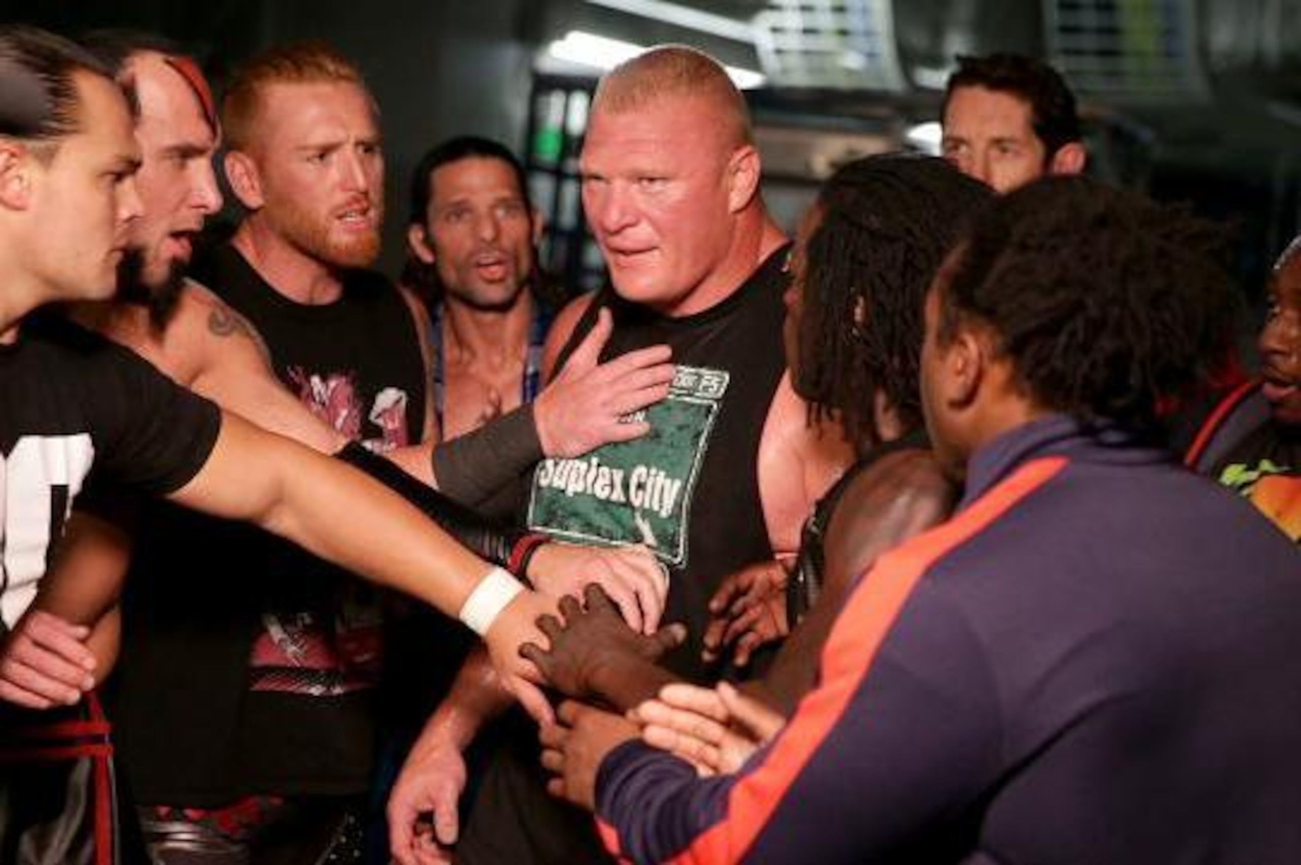 Superstars look to keep Brock Lesnar away from Undertaker.