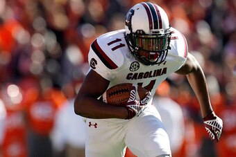 CLEMSON, SC - NOVEMBER 29: Pharoh Cooper #11 of the South Carolina Gamecocks rushes for a touchdown during their game against the Clemson Tigers at Memorial Stadium on November 29, 2014 in Clemson, South Carolina. (Photo by Tyler Smith/Getty Images)