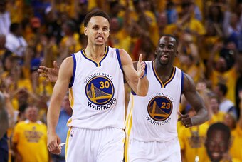 OAKLAND, CA - JUNE 14:  Stephen Curry #30 celebrates with Draymond Green #23 of the Golden State Warriors in the fourth quarter against the Cleveland Cavaliers during Game Five of the 2015 NBA Finals at ORACLE Arena on June 14, 2015 in Oakland, California