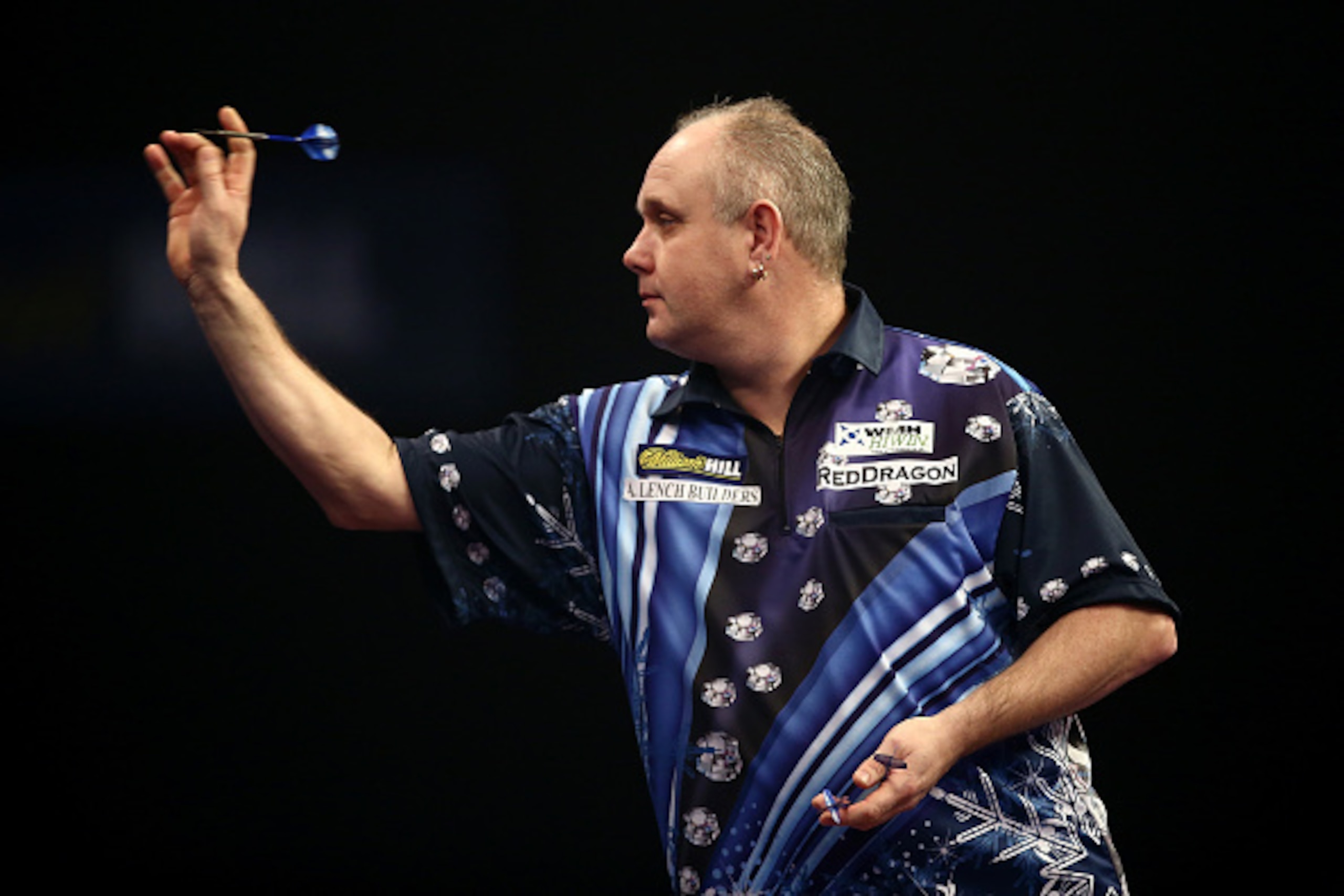 LONDON, ENGLAND - DECEMBER 28:  Ian White of England in action during his second round match against Kim Huybrechts of Belgium on Day Eight of the William Hill PDC World Darts Championships at Alexandra Palace on December 28, 2014 in London, England.  (Ph