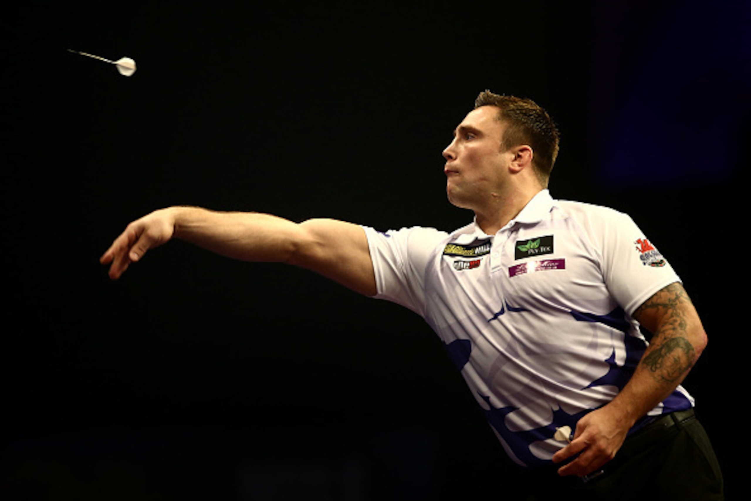 LONDON, ENGLAND - DECEMBER 19:  Gerwyn Price of Wales in action during his first round match against Peter Wright of Scotland on Day Two of the William Hill PDC World Darts Championships at Alexandra Palace on December 19, 2014 in London, England.  (Photo