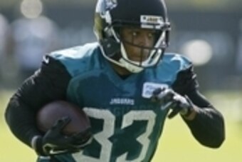 Jun 16, 2015; Jacksonville, FL, USA; Jacksonville Jaguars running back Corey Grant (33) runs with the ball during minicamp at the Florida Blue Health and Wellness Practice Fields. Mandatory Credit: Phil Sears-USA TODAY Sports