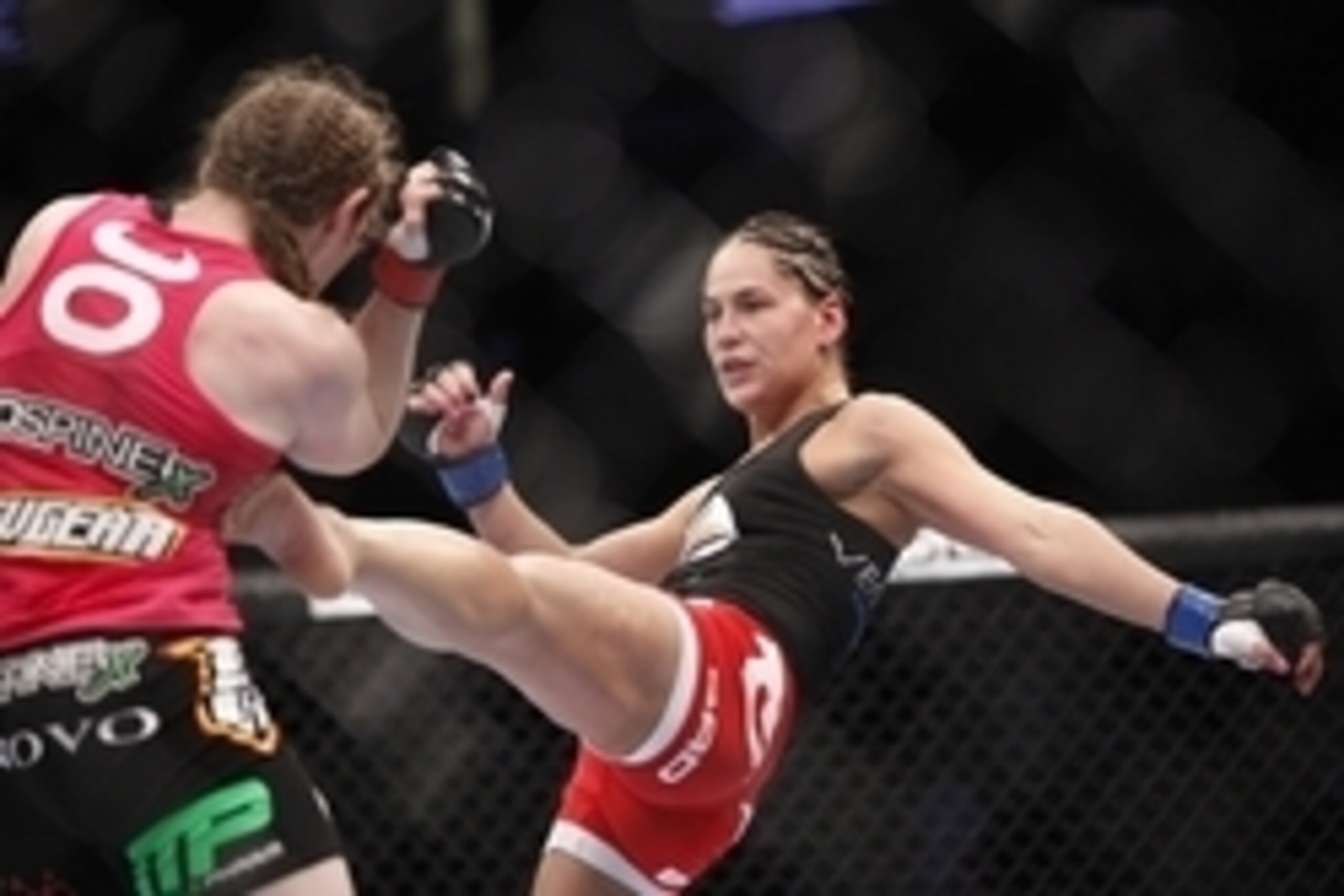 Oct 19, 2013; Houston, TX, USA; Sarah Kaufman (red gloves) fights against Jessica Eye (blue gloves) in their women's bantamweight bout during UFC 166 at Toyota Center. Mandatory Credit: Andrew Richardson-USA TODAY Sports