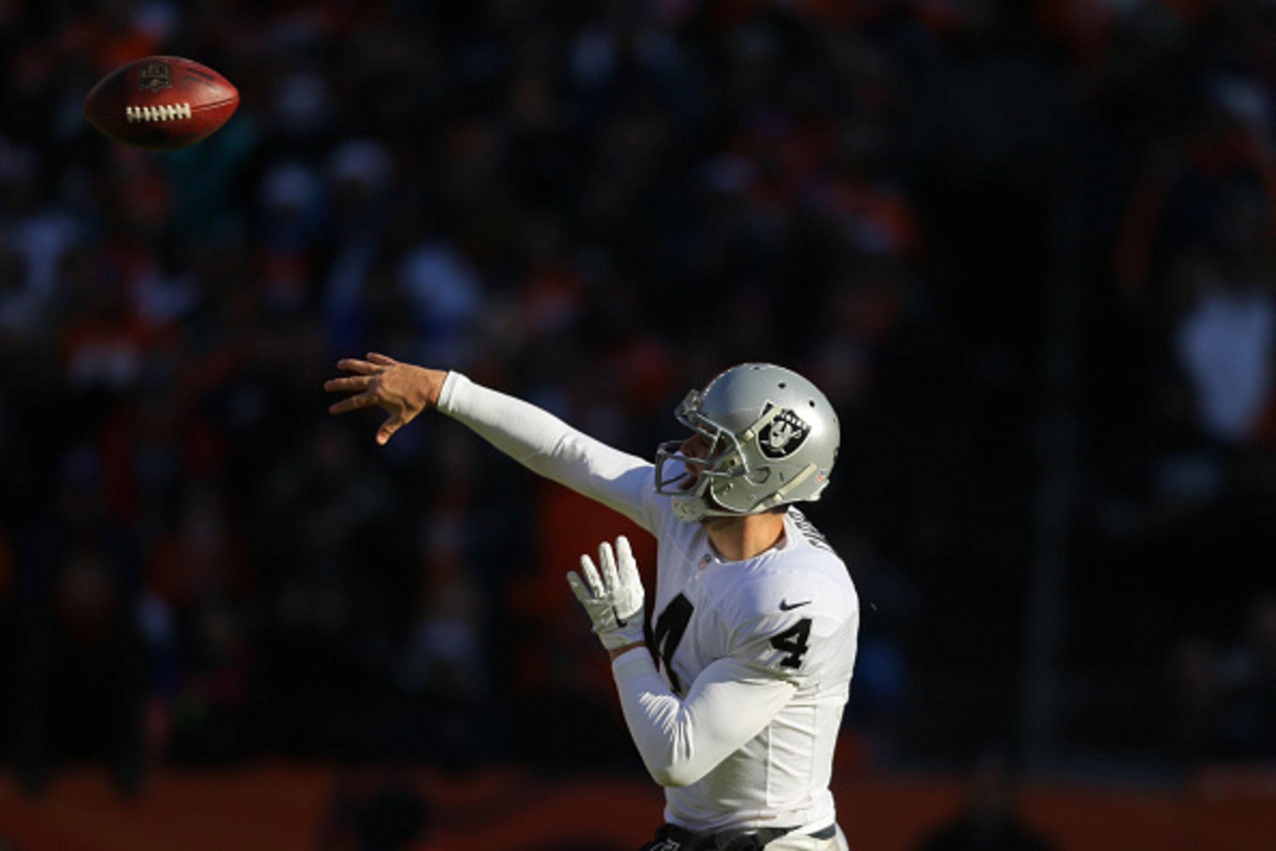 DENVER, CO - DECEMBER 28: Quarterback Derek Carr #4 of the Oakland Raiders in action against the Denver Broncos at Sports Authority Field at Mile High on December 28, 2014 in Denver, Colorado. (Photo by Justin Edmonds/Getty Images)