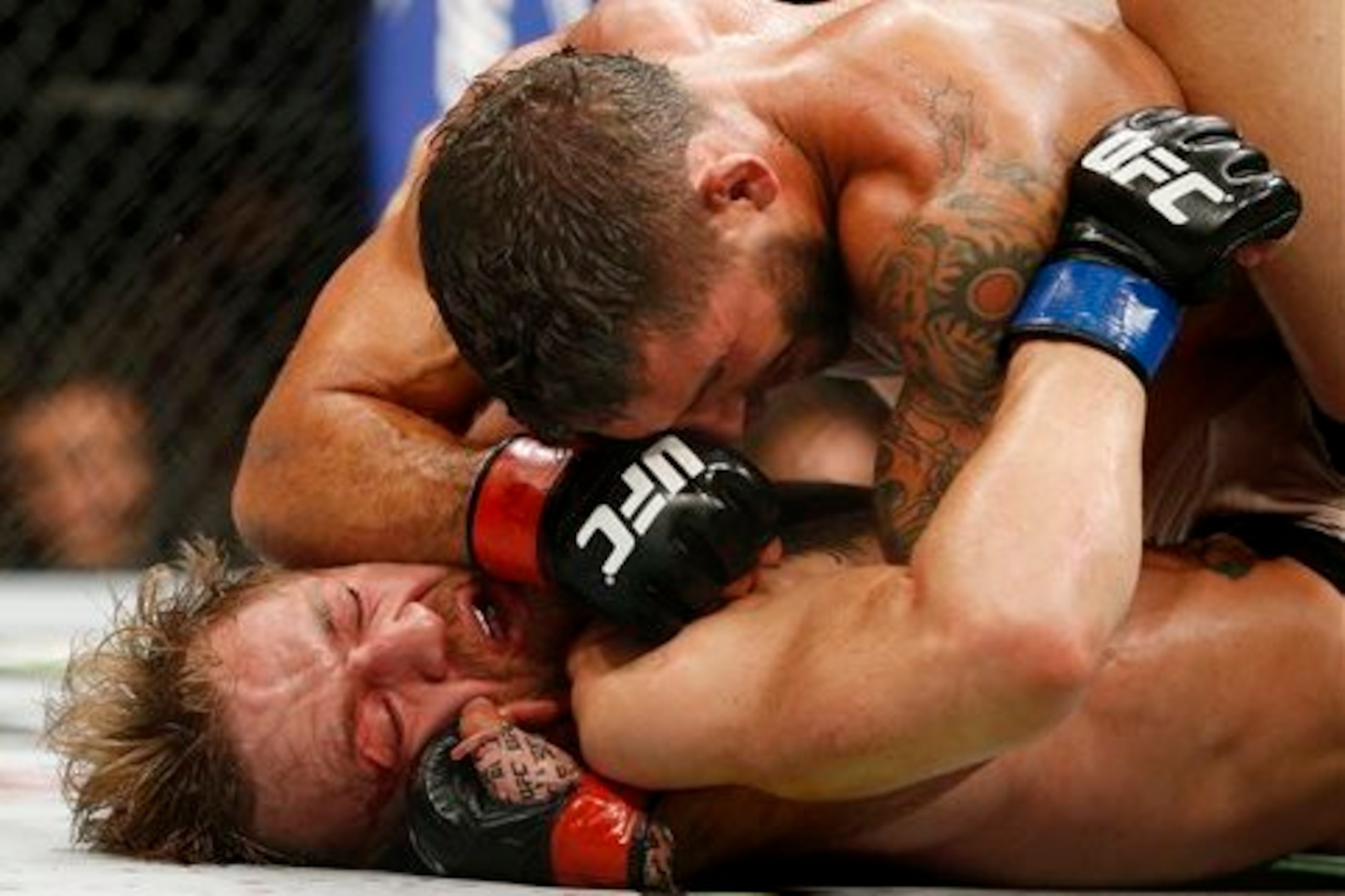 McGregor (bottom) receives an elbow from Chad Mendes at UFC 189 McGregor (bottom) receives an elbow from Chad Mendes at UFC 189