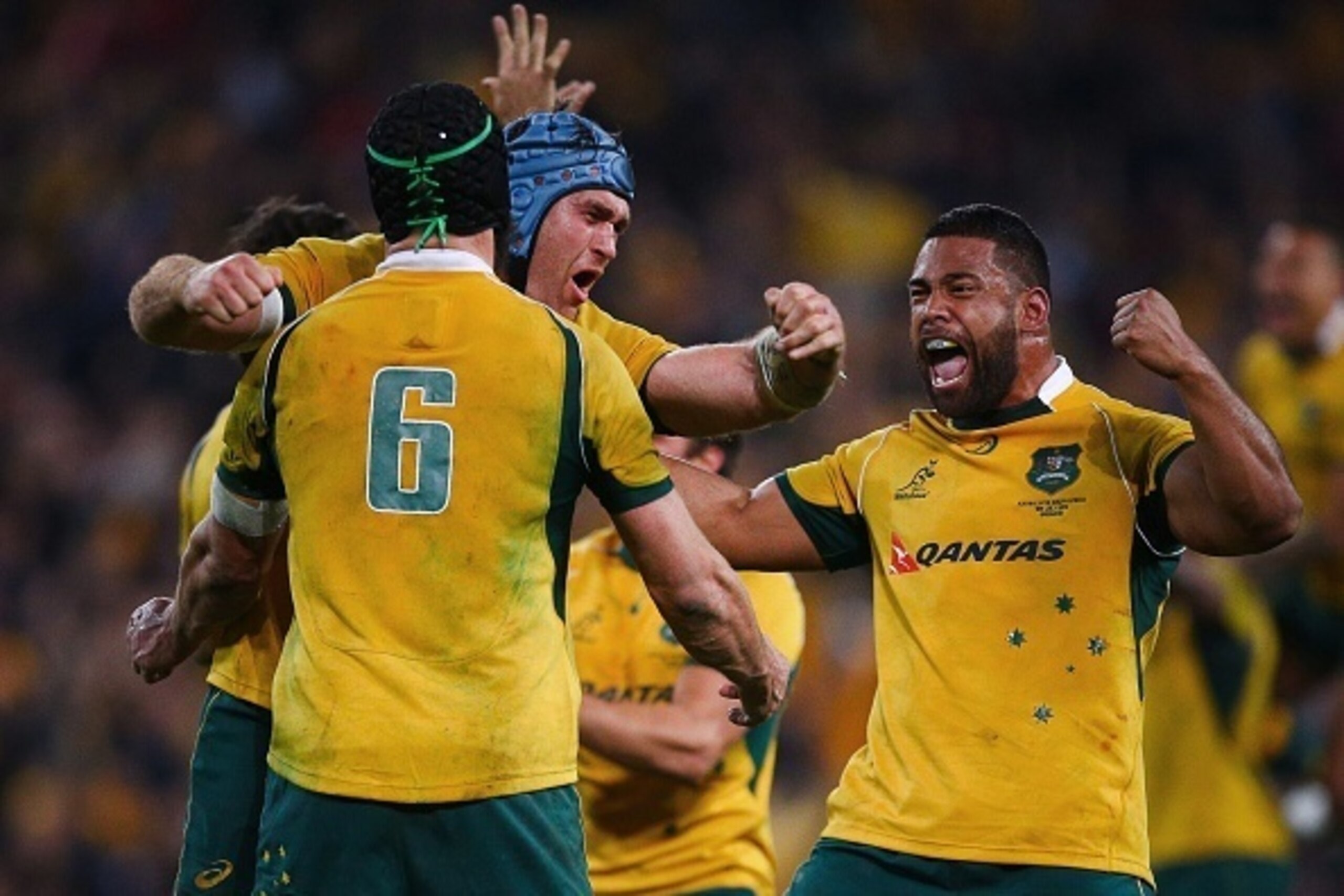James Horwill (L) embraces Scott Fardy (C) and Tatafu Polota-Nau (R) of Australia as they celebrate their victory after the Rugby Championship Test match between Australia and South Africa at Suncorp Stadium, Brisbane on July 18, 2015. AFP PHOTO / PATRIC James Horwill (L) embraces Scott Fardy (C) and Tatafu Polota-Nau (R) of Australia as they celebrate their victory after the Rugby Championship Test match between Australia and South Africa at Suncorp Stadium, Brisbane on July 18, 2015. AFP PHOTO / PATRIC