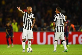 BERLIN, GERMANY - JUNE 06: Arturo Vidal and Carlos Tevez of Juventus react after the second Barcelona goal by Luis Suarez during the UEFA Champions League Final between Juventus and FC Barcelona at Olympiastadion on June 6, 2015 in Berlin, Germany.  (Phot