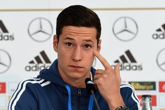 Germany's midfielder Julian Draxler listens to journalists' questions during a press conference of the German national football team in Essen, western Germany on October 13 , 2014, on the eve of the UEFA Euro 2016 qualifing game against Ireland. AFP PHOTO