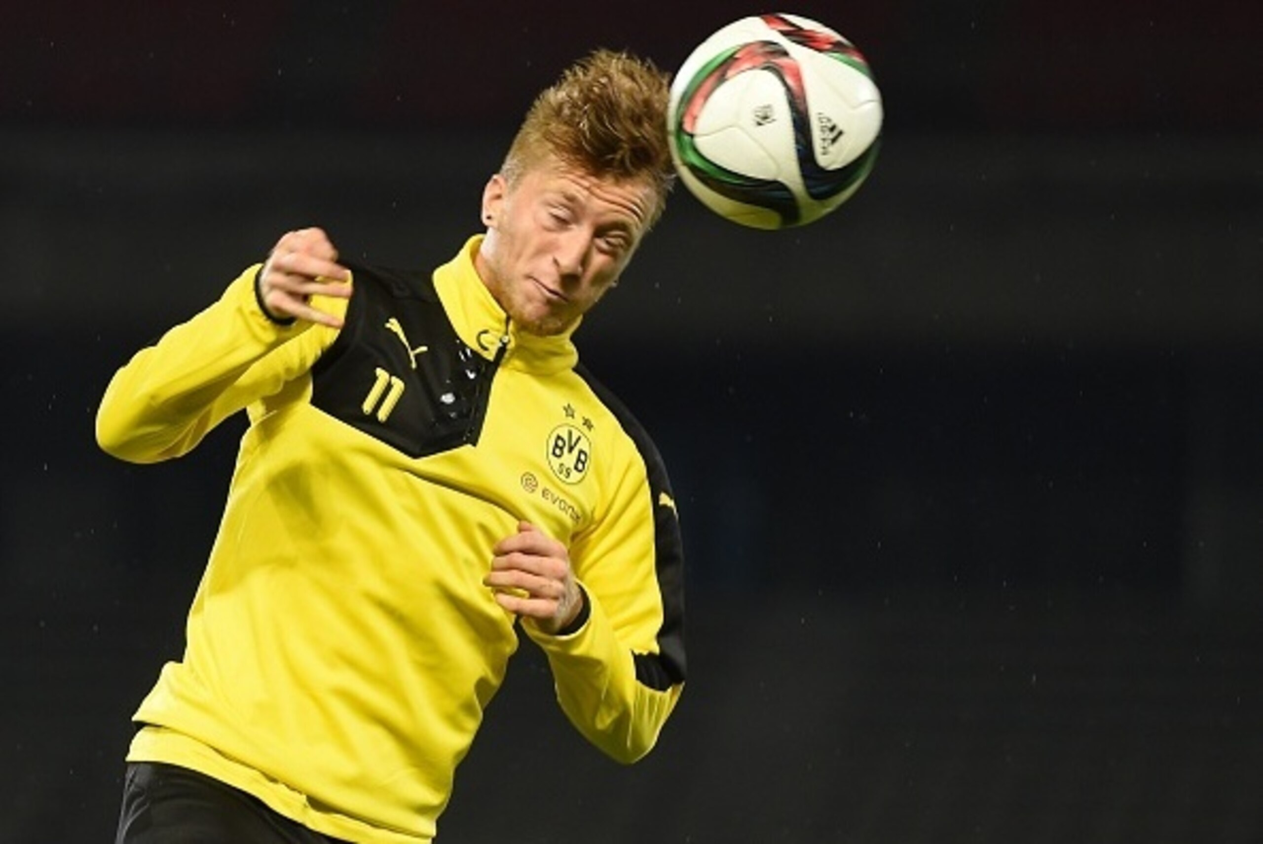 Forward Marco Reus of Germany's football club Borussia Dortmund heads a ball during a training session after their arrival in Japan in Kawasaki, suburb of Tokyo on July 6, 2015.  Borussia Dortmund will play a friendly match with Japan's club Kawasaki Fron