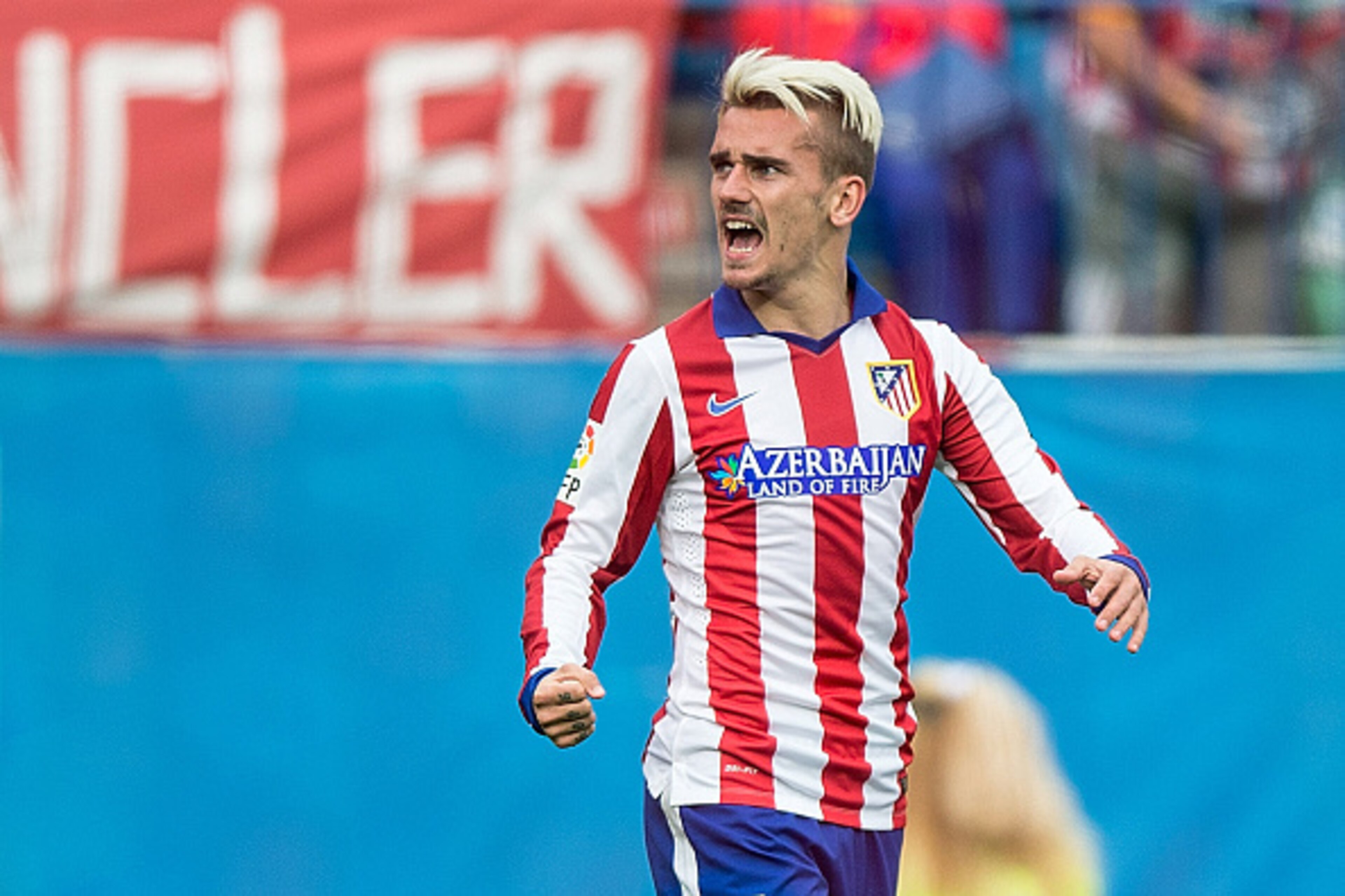 MADRID, SPAIN - APRIL 25: Antoine Griezmann of Atletico de Madrid celebrates scoring their opening goal during the La Liga match between Club Atletico de Madrid and Elche FC at Vicente Calderon Stadium on April 25, 2015 in Madrid, Spain.  (Photo by Gonzal