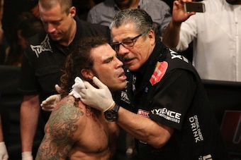 ABU DHABI, UNITED ARAB EMIRATES - APRIL 11:  (L-R) Clay Guida is inspected by Jacob 'Stitch' Duran before Guida faces Tatsuya Kawajiri of Japan during UFC Fight Night 39 at du Arena on April 11, 2014 in Abu Dhabi, United Arab Emirates.  (Photo by Warren L