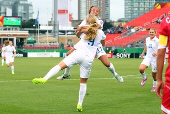 TORONTO, ON - AUGUST 16:  Makenzy Doniak of the United States celebrates with Mallory Pugh after scoring the opening goal during the FIFA U-20 Women's World Cup Canada 2014 Quarter Final match between Korea DPR and the United States at the National Soccer