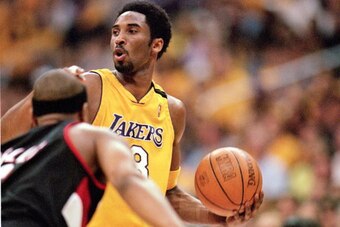 LOS ANGELES - JUNE 4:  Kobe Bryant #8 of the Los Angeles Lakers looks for an open man during Game 7 of the Western Conference Finals against the Portland Trail Blazers at Staples Center on June 4, 2000 in Los Angeles, California. The Lakers won 98-94. NOT