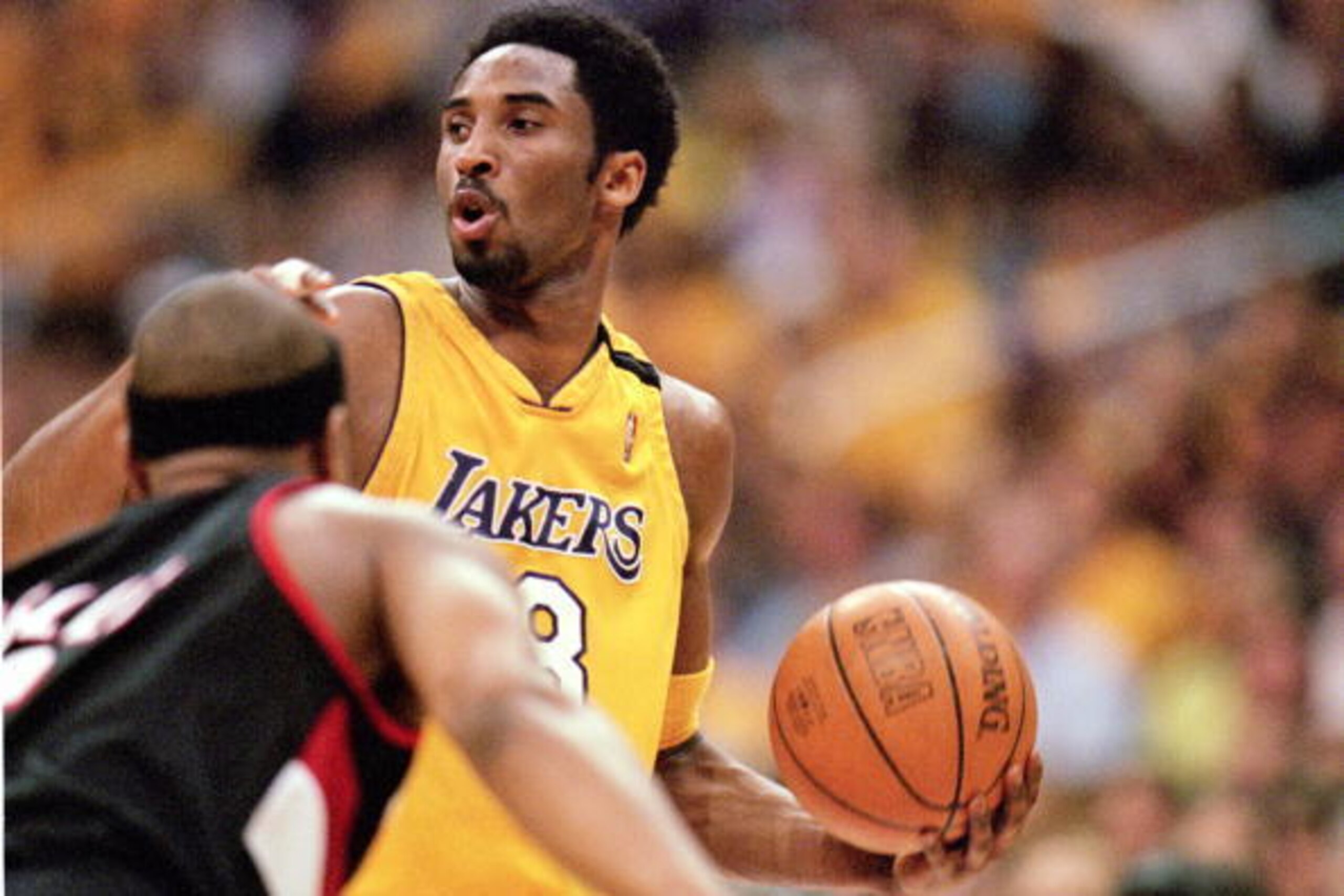 LOS ANGELES - JUNE 4:  Kobe Bryant #8 of the Los Angeles Lakers looks for an open man during Game 7 of the Western Conference Finals against the Portland Trail Blazers at Staples Center on June 4, 2000 in Los Angeles, California. The Lakers won 98-94. NOT