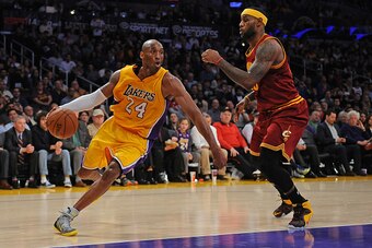LOS ANGELES, CA - JANUARY 15:  Kobe Bryant #24 of the Los Angeles Lakers drives to the basket against LeBron James #23 of the Cleveland Cavaliers on January 15, 2015 at Staples Center in Los Angeles, California. NOTE TO USER: User expressly acknowledges a