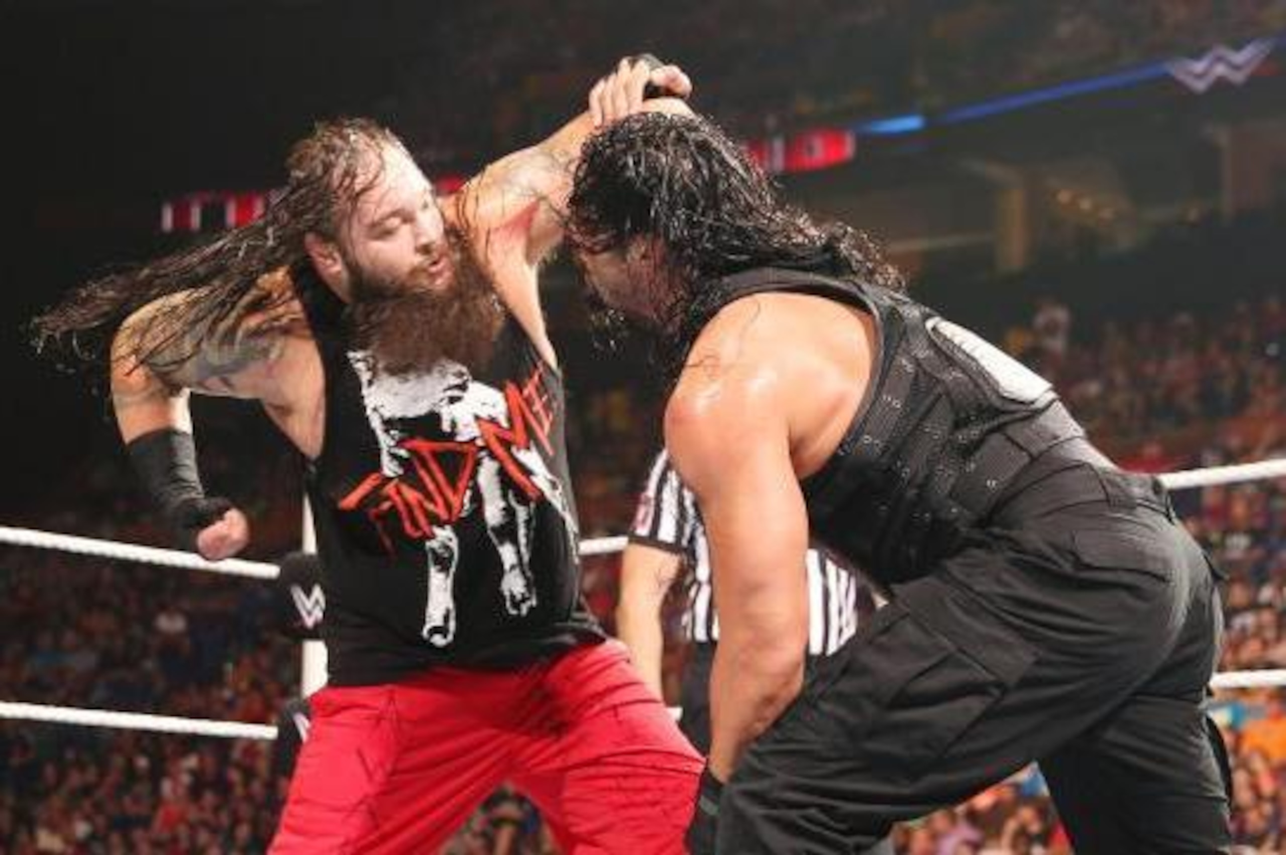 Bray Wyatt attacks Roman Reigns. Bray Wyatt attacks Roman Reigns.