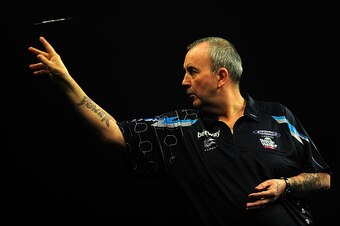 EXETER, ENGLAND - MARCH 05:  Phil Taylor of England competes against James Wade of England during The Betway Premier League Darts at Westpoint Arena on March 5, 2015 in Exeter, England.  (Photo by Dan Mullan/Getty Images)