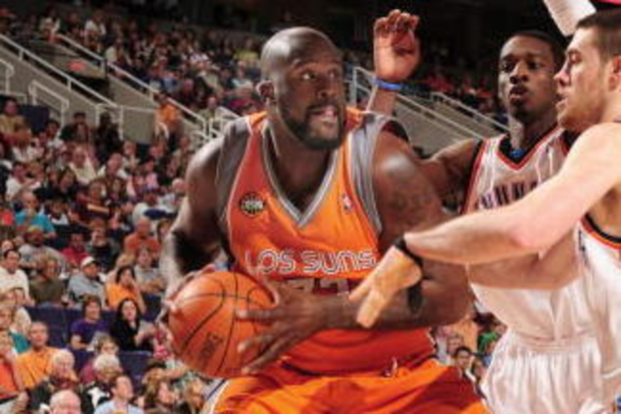 PHOENIX - MARCH 14: Shaquille O'Neal #32 of the Phoenix Suns looks to shoot past Jeff Green #22 and Nick Collison #4 of the Oklahoma City Thunder in an NBA game played on March 14, 2009, at U.S. Airways Center in Phoenix, Arizona. NOTE TO USER: User expr PHOENIX - MARCH 14: Shaquille O'Neal #32 of the Phoenix Suns looks to shoot past Jeff Green #22 and Nick Collison #4 of the Oklahoma City Thunder in an NBA game played on March 14, 2009, at U.S. Airways Center in Phoenix, Arizona. NOTE TO USER: User expr