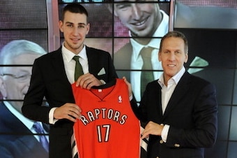 TORONTO - JUNE 24:  Jonas Valanciunas, the Toronto Raptors first round pick (5th overall) in the 2011 NBA Draft, poses with Raptors president and general manager Bryan Colangelo during a press conference at the Air Canada Centre in Toronto, Ontario, Canad