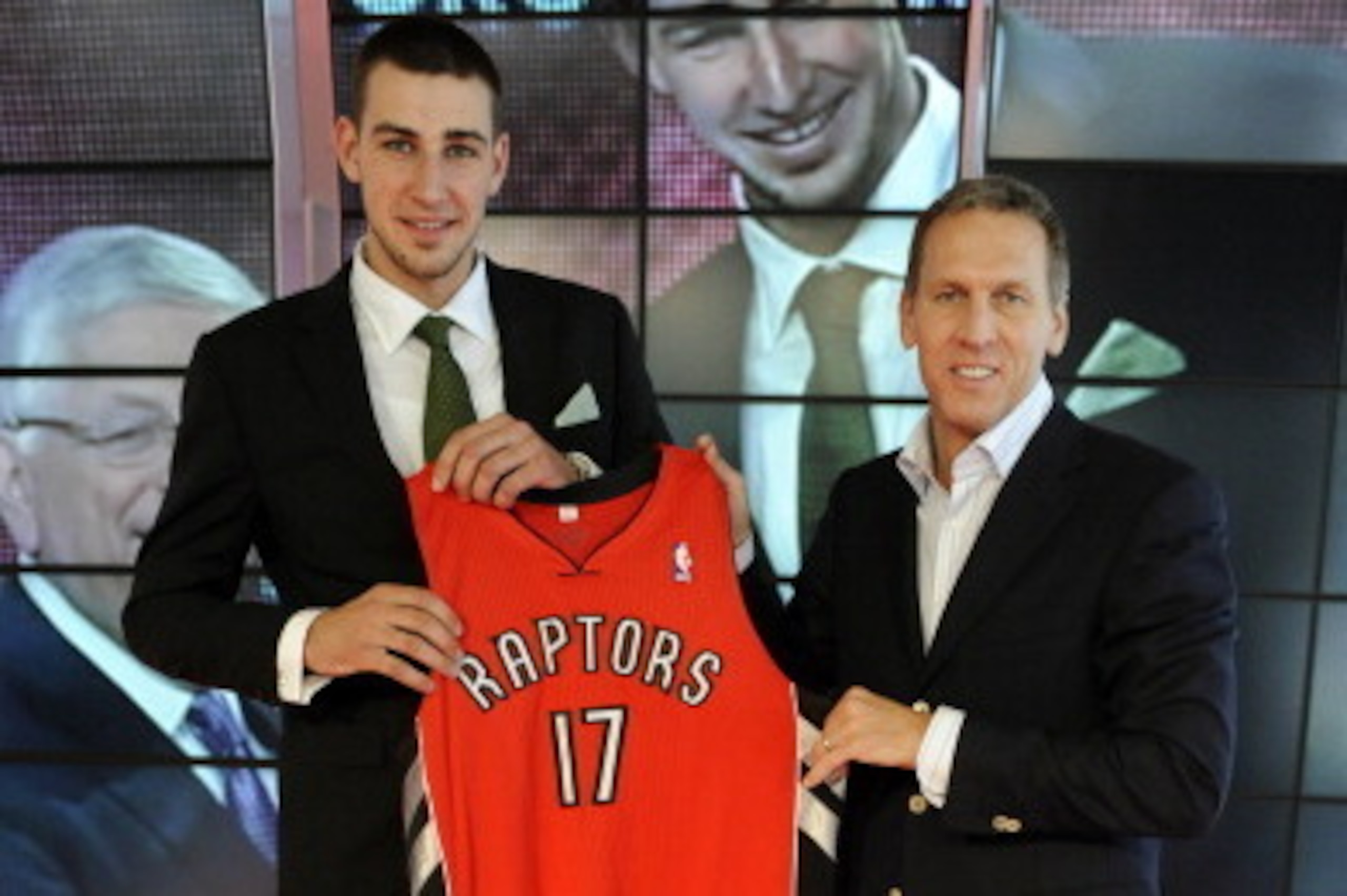 TORONTO - JUNE 24: Jonas Valanciunas, the Toronto Raptors first round pick (5th overall) in the 2011 NBA Draft, poses with Raptors president and general manager Bryan Colangelo during a press conference at the Air Canada Centre in Toronto, Ontario, Canad TORONTO - JUNE 24: Jonas Valanciunas, the Toronto Raptors first round pick (5th overall) in the 2011 NBA Draft, poses with Raptors president and general manager Bryan Colangelo during a press conference at the Air Canada Centre in Toronto, Ontario, Canad