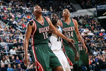 MINNEAPOLIS, MN - OCTOBER 17: Jabari Parker #12 and Giannis Antetokounmpo #34 of the Milwaukee Bucks battle for position against Anthony Bennett #24 of the Minnesota Timberwolves on October 17, 2014 at U.S. Cellular Center in Cedar Rapids, Iowa. NOTE TO U
