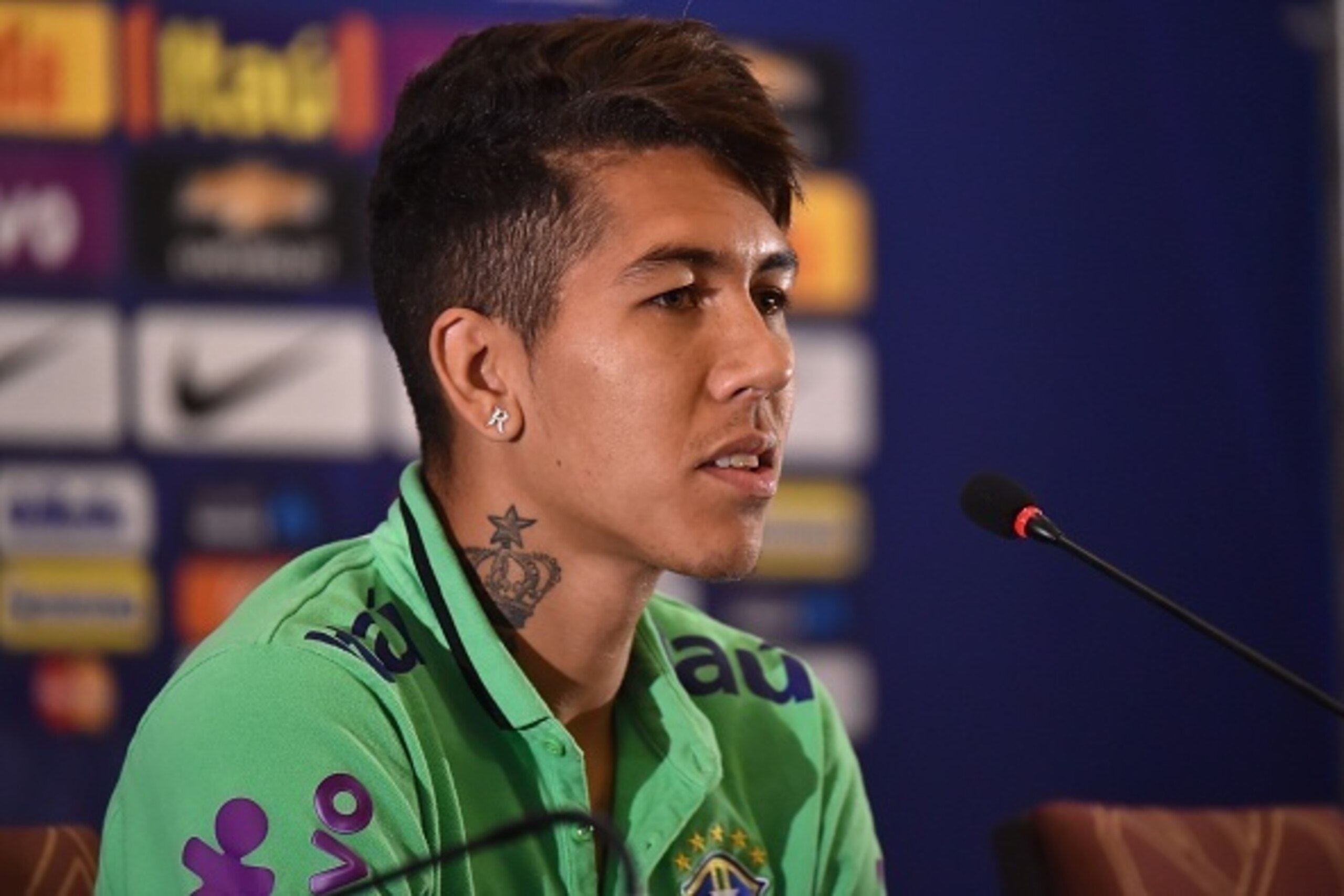 Brazil's player Roberto Firmino listens to a question during a press conference in Santiago, Chile, on June 23, 2015 during the Copa America 2015. AFP PHOTO / Nelson ALMEIDA        (Photo credit should read NELSON ALMEIDA/AFP/Getty Images)