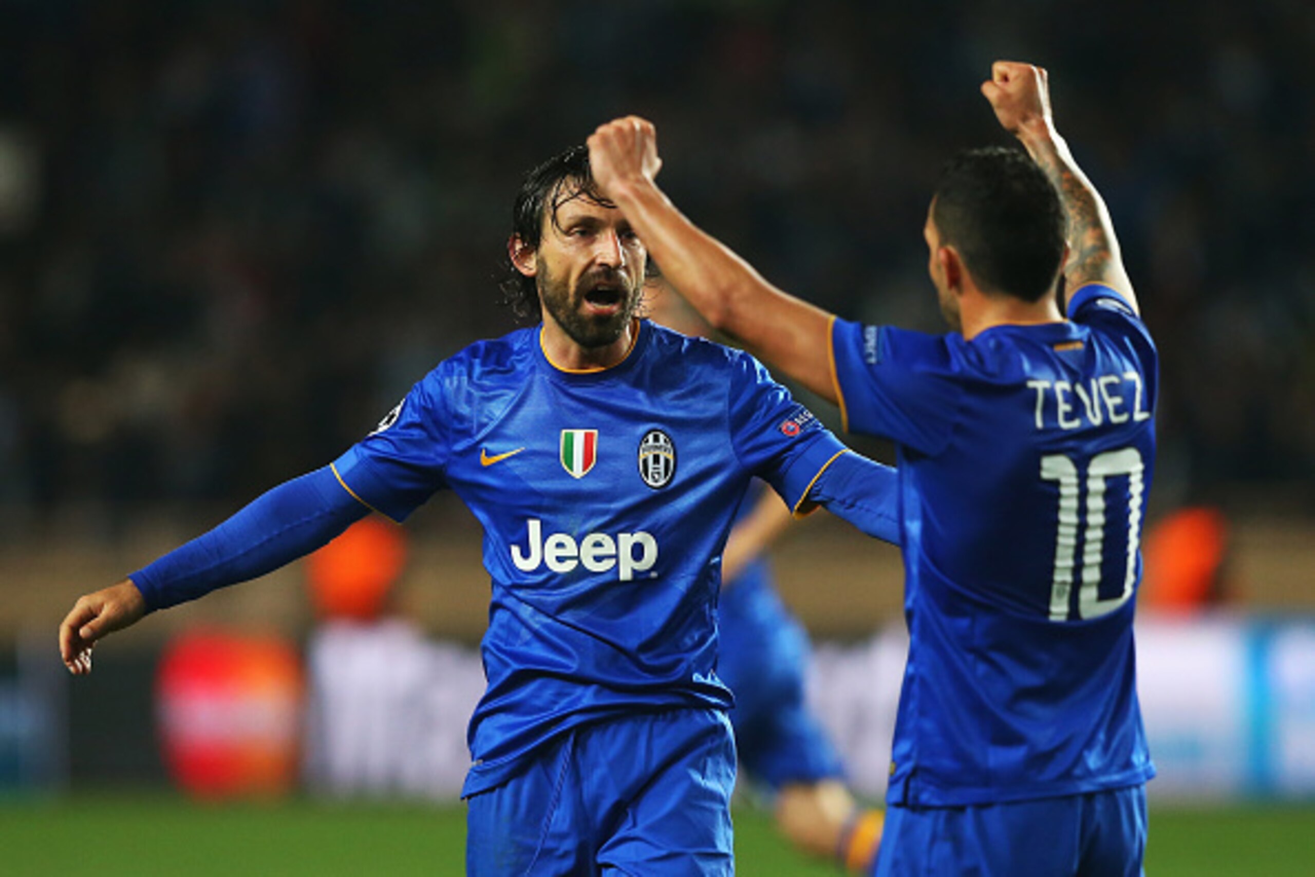 MONACO - APRIL 22: Andrea Pirlo (L) and Carlos Tevez of Juventus celebrate at the final whistle during the UEFA Champions League quarter-final second leg match between AS Monaco FC and Juventus at Stade Louis II on April 22, 2015 in Monaco, Monaco.  (Phot