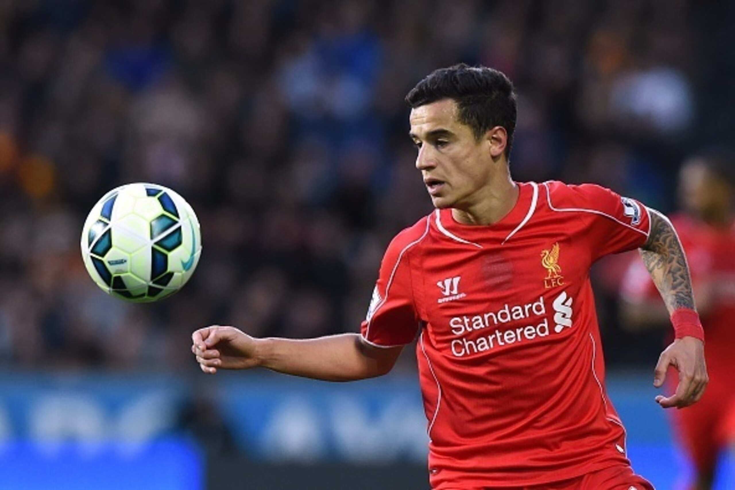 Liverpool's Brazilian midfielder Philippe Coutinho controls the ball during the English Premier League football match between Hull City and Liverpool at the KC Stadium in Hull, northeast England on April 28, 2015.  AFP PHOTO / PAUL ELLIS

RESTRICTED TO ED