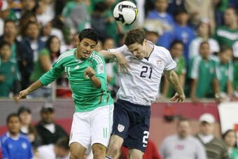 HOUSTON - FEBRUARY 06:  Drew Moor #21 of the U.S. MNT and Carlos Vela #11 of Mexico battle for a header February 6, 2008 at Reliant Stadium in Houston, Texas.  (Photo by Bob Levey/Getty Images)