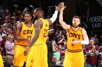 CLEVELAND, OH - JUNE 9:  Teammates LeBron James #23 of the Cleveland Cavaliers and Matthew Dellavedova #8 of the Cleveland Cavaliers high-five during Game Three of the 2015 NBA Finals at The Quicken Loans Arena on June 9, 2015 in Cleveland, Ohio. NOTE TO 