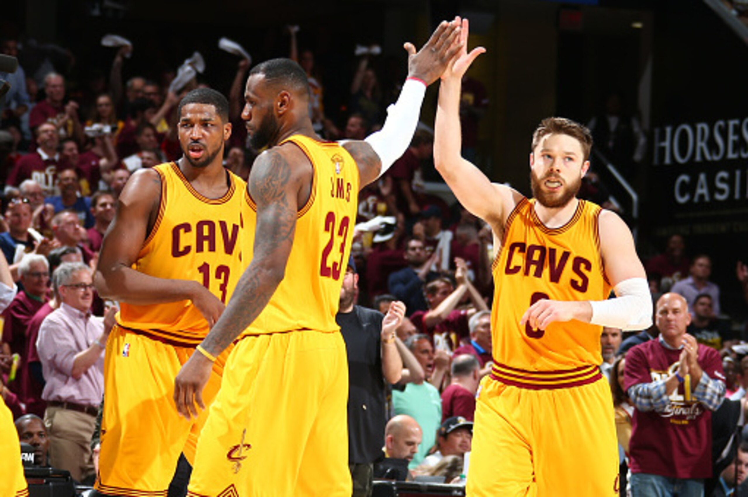 CLEVELAND, OH - JUNE 9:  Teammates LeBron James #23 of the Cleveland Cavaliers and Matthew Dellavedova #8 of the Cleveland Cavaliers high-five during Game Three of the 2015 NBA Finals at The Quicken Loans Arena on June 9, 2015 in Cleveland, Ohio. NOTE TO 