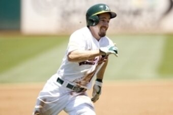 Jul 4, 2015; Oakland, CA, USA; Oakland Athletics outfielder Billy Burns (1) rounds third base before scoring a run against the Seattle Mariners in the first inning at O.co Coliseum. Mandatory Credit: Cary Edmondson-USA TODAY Sports