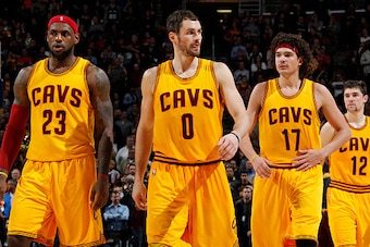 CLEVELAND, OH - NOVEMBER 19: LeBron James #23, Kevin Love #0, Anderson Varejao #17, and Joe Harris #12 of the Cleveland Cavaliers stand on the court during a game against the San Antonio Spurs on November 19, 2014 at Quicken Loans Arena in Cleveland, Ohio
