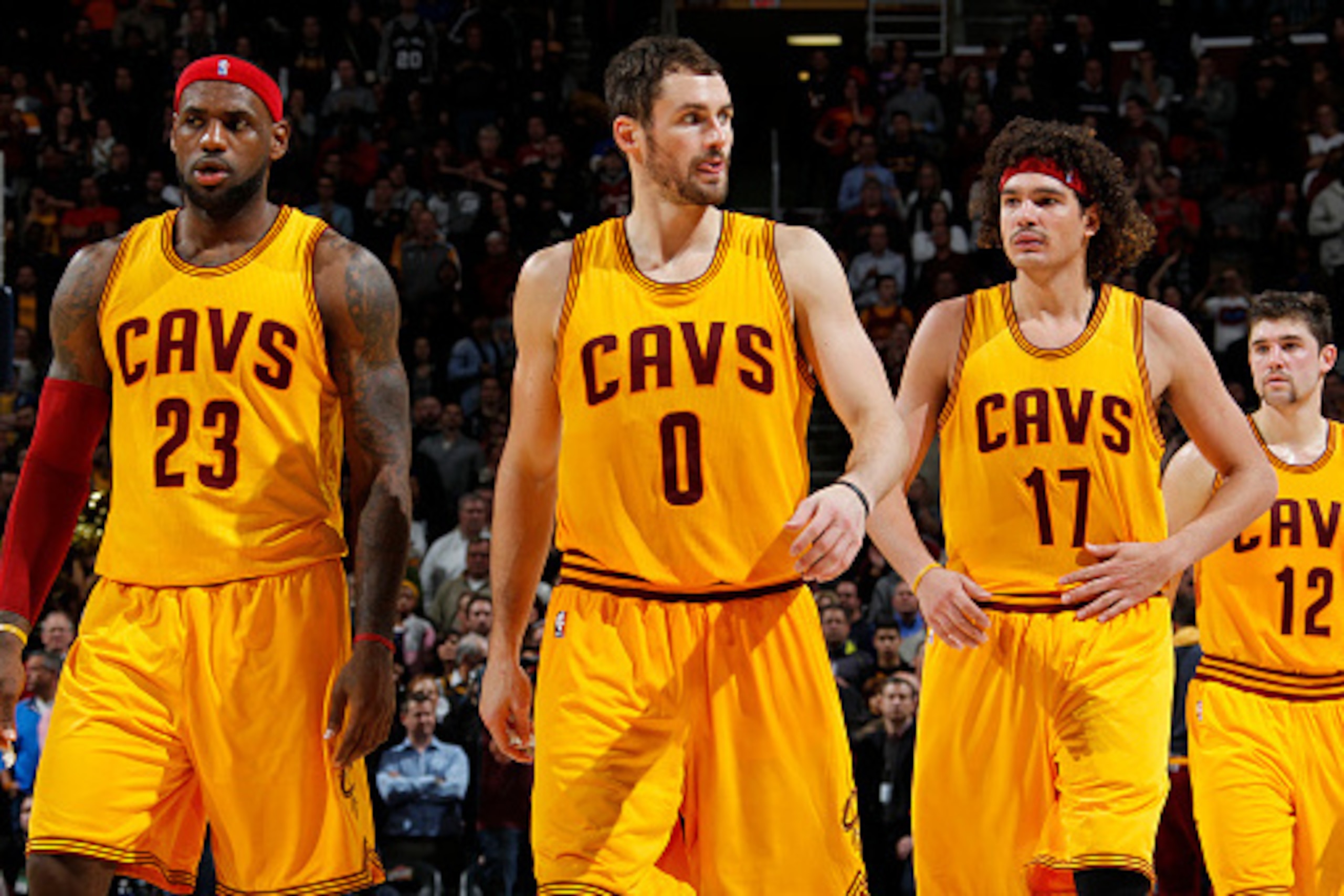 CLEVELAND, OH - NOVEMBER 19: LeBron James #23, Kevin Love #0, Anderson Varejao #17, and Joe Harris #12 of the Cleveland Cavaliers stand on the court during a game against the San Antonio Spurs on November 19, 2014 at Quicken Loans Arena in Cleveland, Ohio