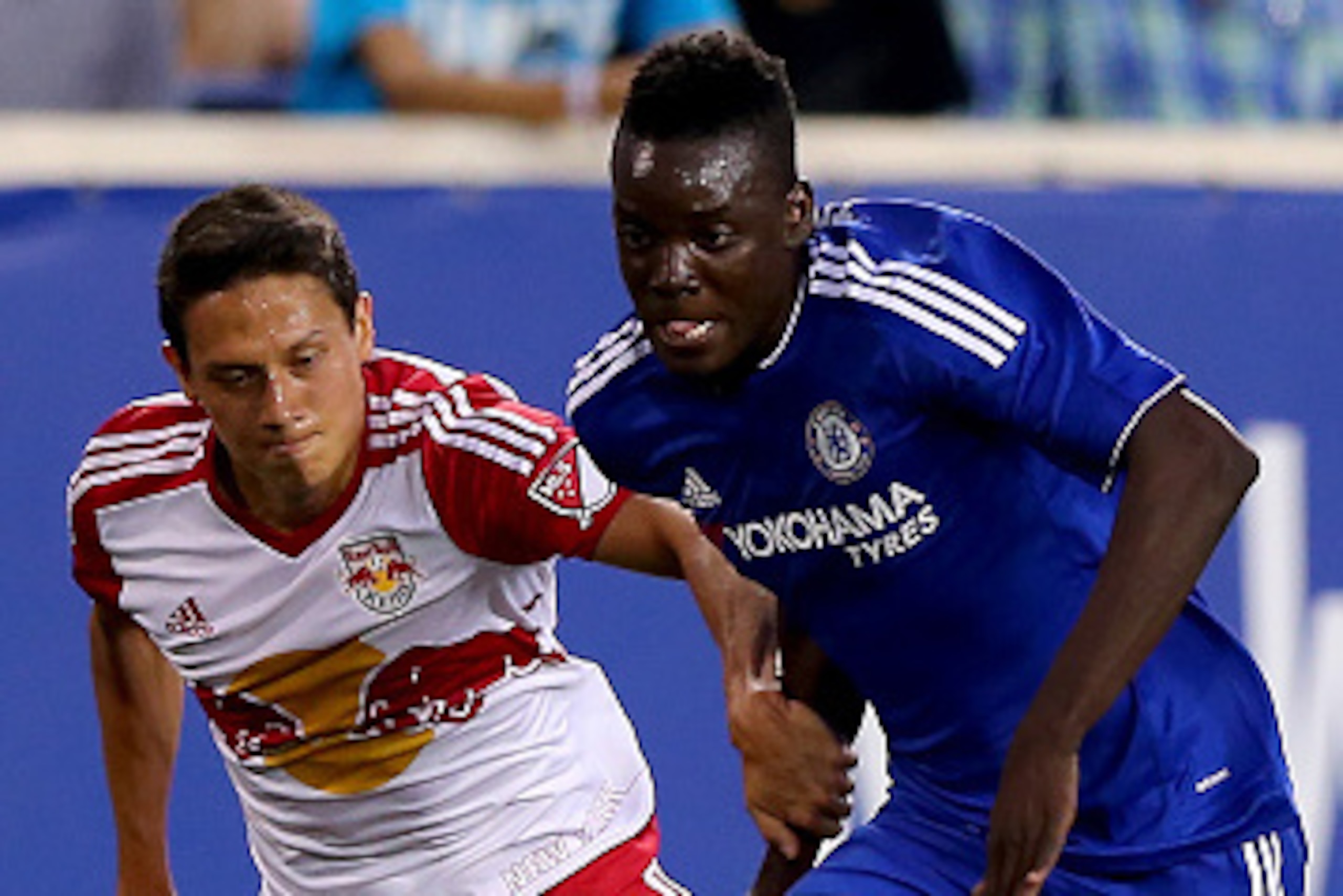 HARRISON, NJ - JULY 22:  Bertrand Traore #14 of Chelsea takes the ball as Sean Davis #27 of New York Red Bulls defends during the International Champions Cup at Red Bull Arena on July 22, 2015 in Harrison, New Jersey.  (Photo by Elsa/Getty Images)