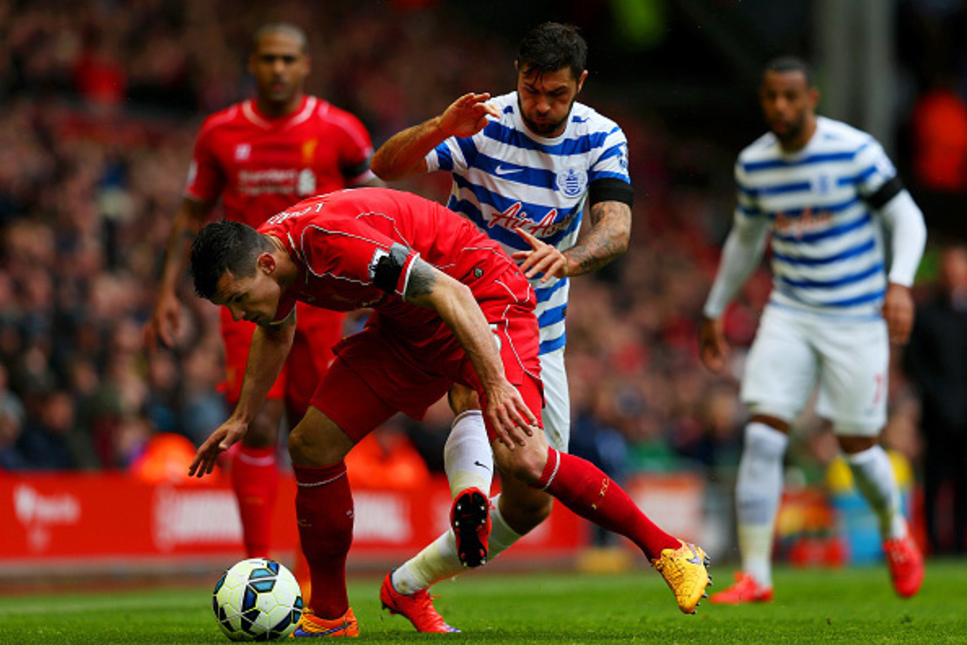 LIVERPOOL, ENGLAND - MAY 02: Charlie Austin of QPR challenges Dejan Lovren of Liverpool during the Barclays Premier League match between Liverpool and Queens Park Rangers at Anfield on May 2, 2015 in Liverpool, England. (Photo by Alex Livesey/Getty Image LIVERPOOL, ENGLAND - MAY 02: Charlie Austin of QPR challenges Dejan Lovren of Liverpool during the Barclays Premier League match between Liverpool and Queens Park Rangers at Anfield on May 2, 2015 in Liverpool, England. (Photo by Alex Livesey/Getty Image