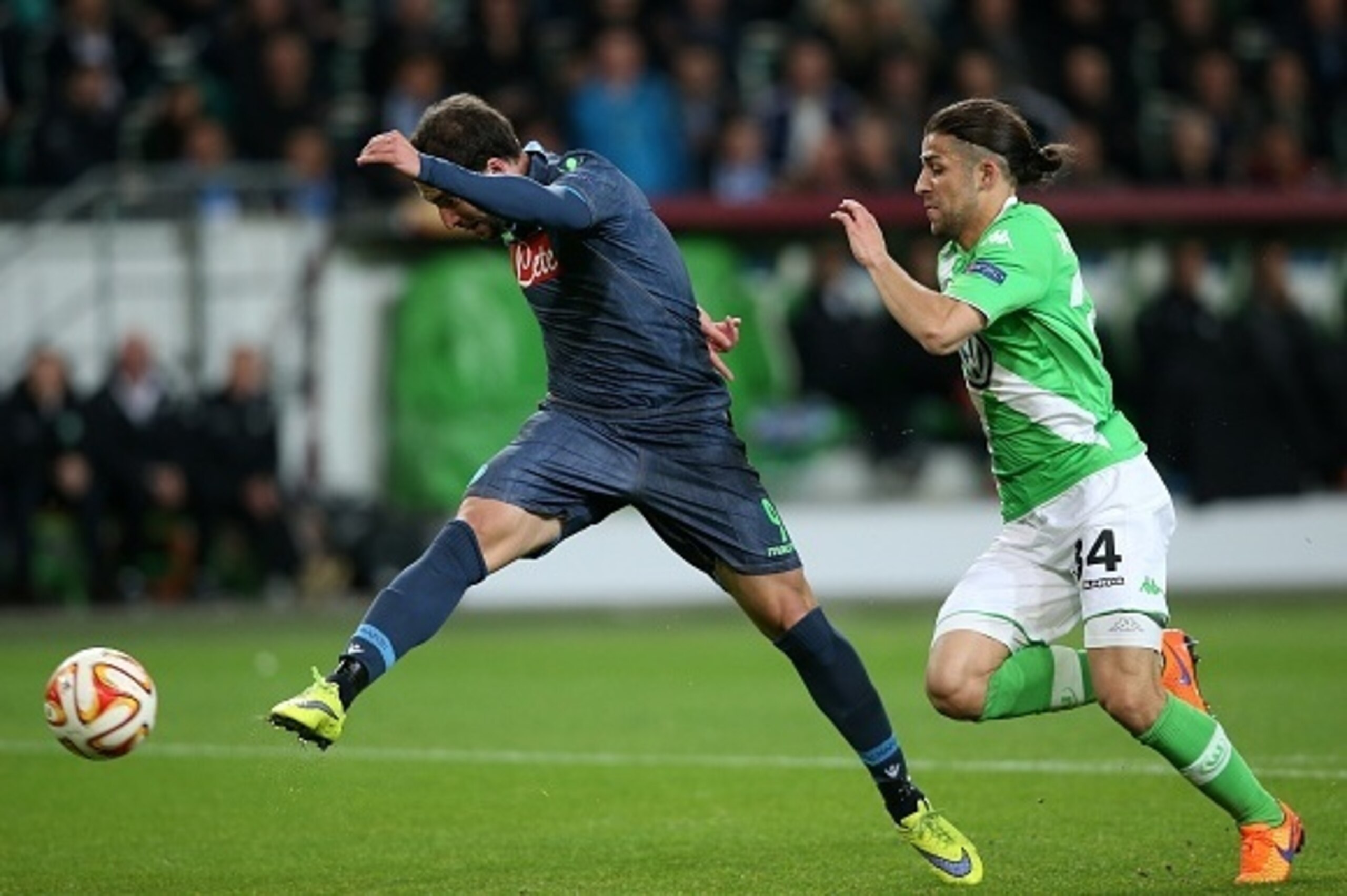Napoli's Argentinian forward Gonzalo Higuain (L) scores his team's opening goal next to Wolfsburg's Swiss defender Ricardo Rodriguez during the UEFA Europa League first-leg quarter-final football match VfL Wolfsburg v SSC Napoli in Wolfsburg on April 16, Napoli's Argentinian forward Gonzalo Higuain (L) scores his team's opening goal next to Wolfsburg's Swiss defender Ricardo Rodriguez during the UEFA Europa League first-leg quarter-final football match VfL Wolfsburg v SSC Napoli in Wolfsburg on April 16,
