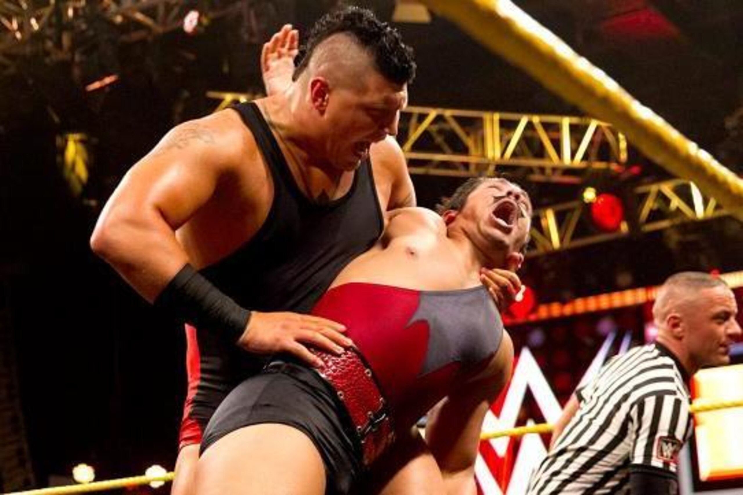 Sawyer Fulton puts Simon Gotch in an abdominal stretch.